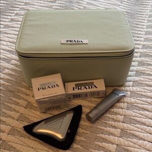 Prada Beauty gua sha, box, and Augmented Skin deluxe samples